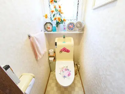 a bathroom with a toilet with flowers on it at Koka House TOKYO ASAKUSA in Tokyo