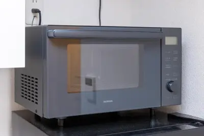 a microwave oven sitting on top of a counter at \u30e1\u30be\u30f3\u30a2\u30eb\u30c7\u30d0\u30e9\u30f3 in Tokyo