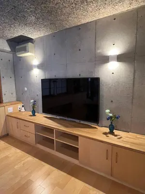 a large entertainment center with a large flat screen tv at Sunshine in Tokyo