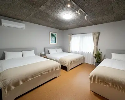 a bedroom with two beds and a window at Sunshine in Tokyo
