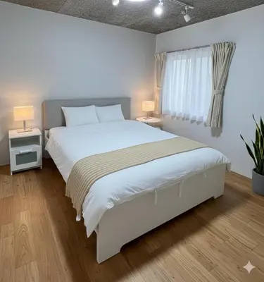 a bedroom with a large white bed and a window at Sunshine in Tokyo