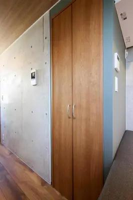 a hallway with wooden doors in a building at Life Town Oshiage - Compact Stay - Steps from Skytree in Tokyo