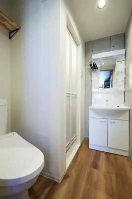 a bathroom with a white toilet and a sink at Life Town Oshiage - Compact Stay - Steps from Skytree in Tokyo