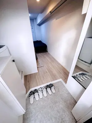 a room with four pairs of shoes on the floor at West Shinjuku Entire House with 2beds in Tokyo