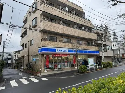 a building with a store on the side of a street at PremiumStay Komagome in Tokyo
