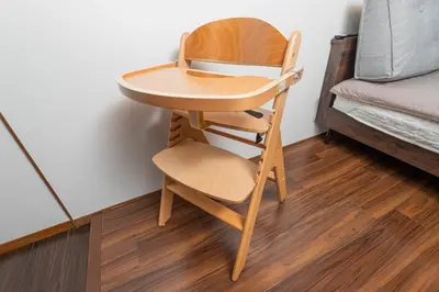 a wooden chair and a table next to a bed at PremiumStay Komagome in Tokyo