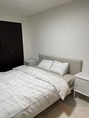 a bedroom with a white bed with two pillows at Mark\u7684\u8db3\u7acb\u6c11\u5bbf in Tokyo