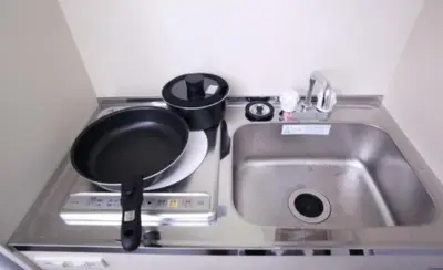 a kitchen sink with a pot on top of it at iine house hatagaya in Tokyo