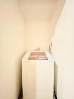 a small white refrigerator in a corner of a room at suny503-SJ0008 in Tokyo