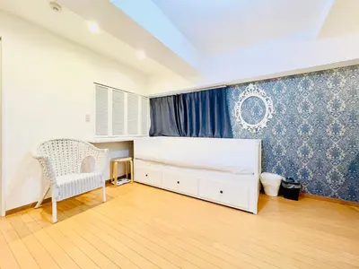a bedroom with a bed and a chair in it at suny503-SJ0008 in Tokyo