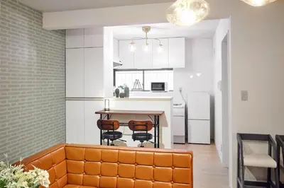 a kitchen and dining room with a table and chairs at Simple Stay ShibuyaShinjyuku in Tokyo