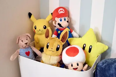 a bunch of stuffed animals sitting in a crib at Simple Stay ShibuyaShinjyuku in Tokyo