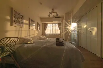 a bedroom with a large bed and a window at 5min Tachiaigawa Station Max 4 Haneda 17min in Tokyo