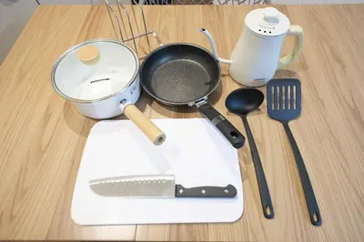 a cutting board with a pan and utensils on a table at 5min Tachiaigawa Station Max 4 Haneda 17min in Tokyo
