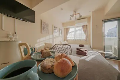 a table with two plates of bread and a cup of coffee at 5min Tachiaigawa Station Max 4 Haneda 17min in Tokyo