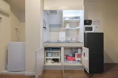 a small kitchen with a sink and a refrigerator at 5min Tachiaigawa Station Max 4 Haneda 17min in Tokyo