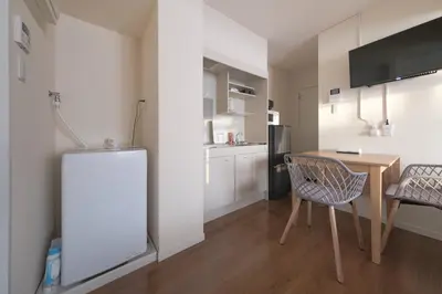 a kitchen and dining room with a table and chairs at 5min Tachiaigawa Station Max 4 Haneda 17min in Tokyo