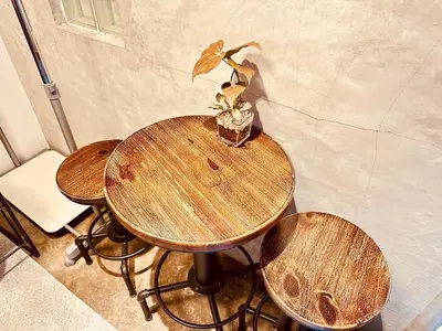 a table with two chairs and a plant on it at Hotel Axel Shinjuku in Tokyo