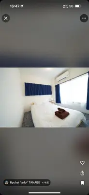 a hotel room with a bed and a window at househotel\u4e0a\u91ce \u5165\u8c37 in Tokyo
