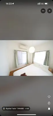 a bedroom with a white bed and two windows at househotel\u4e0a\u91ce \u5165\u8c37 in Tokyo