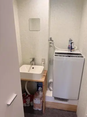 a small bathroom with a sink and a white sink at househotel\u4e0a\u91ce \u5165\u8c37 in Tokyo