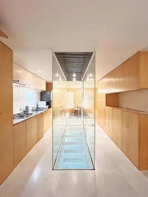 a kitchen with a glass wall in the middle at \u6c60\u888b\u8fd1\u304f\u5e83\u3005\u5feb\u9069\u306a\u4e00\u8ed2\u5bb6unbound in Tokyo
