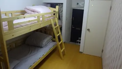 a couple of bunk beds in a room at \u65b0\u5bbf\u6771\u4eac\u6696\u623f in Tokyo