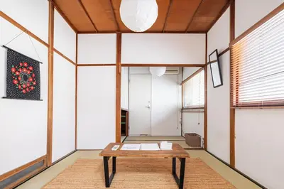 a room with a wooden table in the middle of it at \u30b9\u30de\u30a4\u30eb\u30cf\u30a6\u30b9 in Tokyo