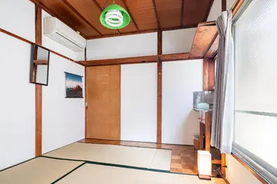 an empty room with a door and a window at \u30b9\u30de\u30a4\u30eb\u30cf\u30a6\u30b9 in Tokyo