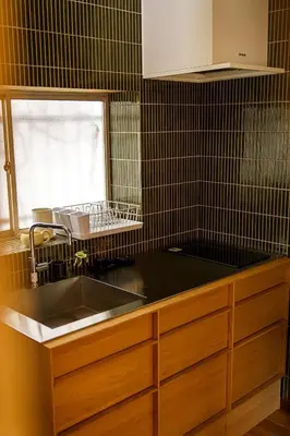 a kitchen counter with a sink and a window at Bright Park House in central Tokyo in Tokyo