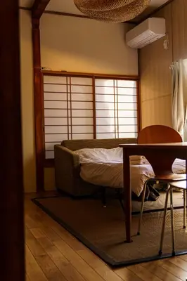 a room with a bed and a table and a window at Bright Park House in central Tokyo in Tokyo
