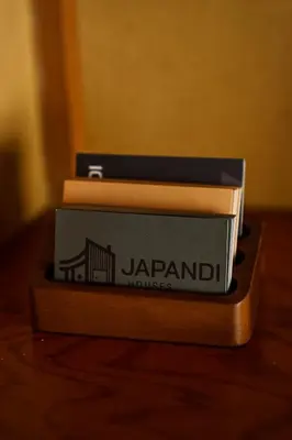 a stack of books sitting on top of a table at Bright Park House in central Tokyo in Tokyo