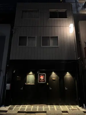 a black building with a sign in front of it at \u548c\u306e\u5bbf\u30db\u30c6\u30ebYamatoinn Akihabara#101 in Tokyo