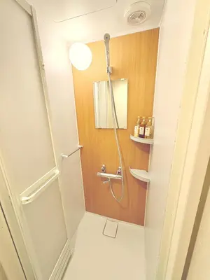 a bathroom with a shower and a toilet at \u548c\u306e\u5bbf\u30db\u30c6\u30ebYamatoinn Akihabara#101 in Tokyo