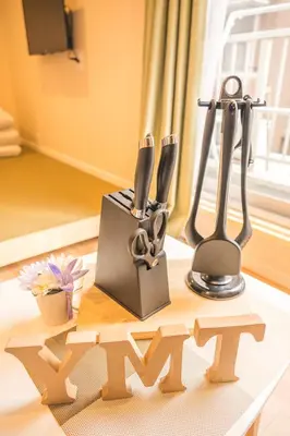 a table with knives and utensils on it at \u548c\u306e\u5bbf\u30db\u30c6\u30ebYamatoinn Akihabara#101 in Tokyo