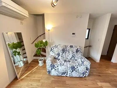 a blue and white chair in a living room at Ueno new villa in Tokyo
