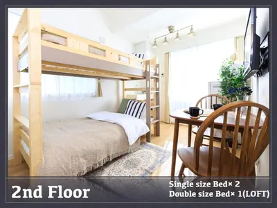 a bedroom with a bunk bed and a table at Skytree 13 minute drive Exclusive whole home stay in Tokyo
