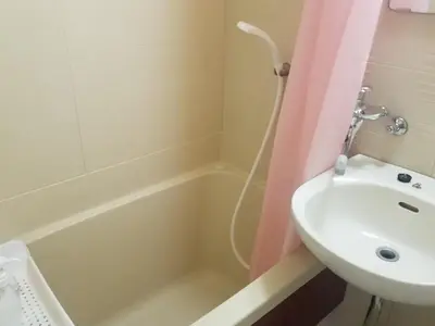 a bathroom with a sink and a tub and a toilet at Sun and Moon\u30db\u30c6\u30eb302 in Tokyo