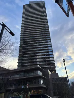 a tall building with a lot of windows at \u5409\u5c4b-\u65b0\u5bbf in Tokyo