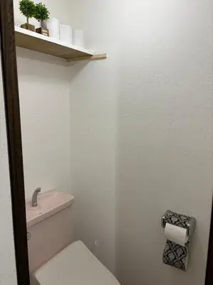 a bathroom with a white toilet and a sink at \u5409\u5c4b-\u65b0\u5bbf in Tokyo