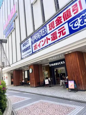 a store front of a building with signs on it at Toyo Shinagawa in Tokyo