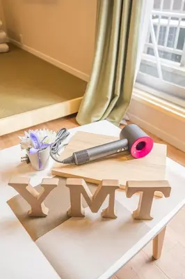 a wooden table with a knife and scissors on it at \u548c\u306e\u5bbf\u30db\u30c6\u30ebYamatoinn Akihabara#401 in Tokyo