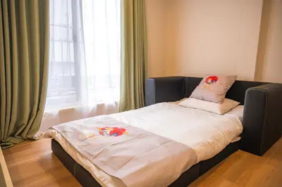 a bed in a room with a large window at \u548c\u306e\u5bbf\u30db\u30c6\u30ebYamatoinn Akihabara#401 in Tokyo