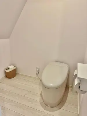 a white bathroom with a toilet in a room at MY House YANESEN Tokyo in Tokyo