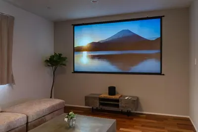 a living room with a flat screen tv on the wall at FRt\u5e73\u4e95\u6238\u5efa\u3066 in Tokyo