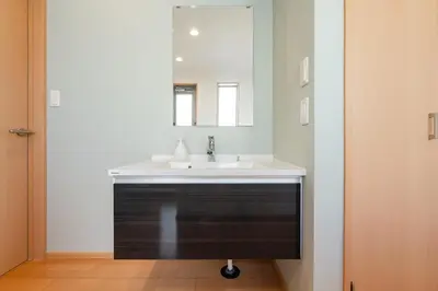 a bathroom with a sink and a mirror at FRt\u5e73\u4e95\u6238\u5efa\u3066 in Tokyo