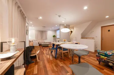 a dining room and living room with a table and chairs at FRt\u5e73\u4e95\u6238\u5efa\u3066 in Tokyo