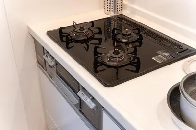 a stove top oven sitting on top of a kitchen counter at STs\u7b39\u585a2\u4e01\u76ee in Tokyo