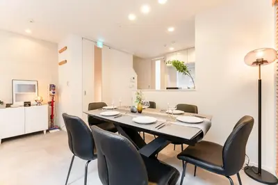 a dining room with a table and chairs at STs\u7b39\u585a2\u4e01\u76ee in Tokyo