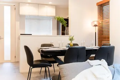 a kitchen and dining room with a table and chairs at STs\u7b39\u585a2\u4e01\u76ee in Tokyo